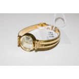 A ladies 18 carat gold Delano wristwatch with 18 carat integral bracelet