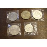 A collection of five U.S.A. silver dollars