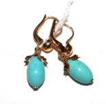 A pair of 18 carat gold earrings set possibly with turquoise