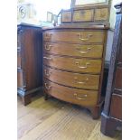 A George III style bowfront chest, with five graduated long drawers on bracket feet, 63cm wide