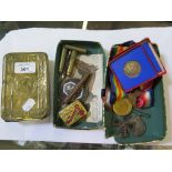 Three First World War medals, a German 1914 Iron Cross, a 1935 Jubilee coin and a Princess Mary box,