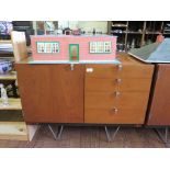 A Stag 'S' Range teak sideboard, designed by John and Sylvia Reid, the singe door beside four