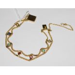 A 9 carat gold multi gem set bracelet