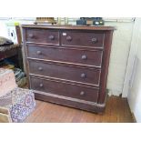 A Victorian mahogany chest of drawers, with two short and three long graduated panelled drawers on a