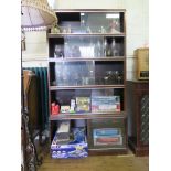 A Minty dark oak stacking bookcase, the five graduated tiers with sliding glass doors, 167cm high,