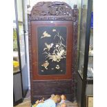 A Japanese two fold screen, the lacquer Shibayama style panels inset in mother of pearl to depict