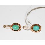 A pair of turquoise earrings for pierced ears