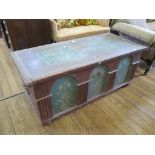 A Dutch style painted pine chest, the hinged lid over a triple arch front painted with flowers on