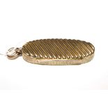 A 9 carat gold oval pill box having ribbed decoration