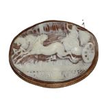 A large cameo depicting a Classical figure in a horse drawn chariot