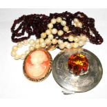 A string of cultured pearls, a string of garnet, a silver Scottish brooch and a cameo