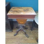 A late Victorian inlaid walnut sewing table with paterae inlay, the hinged top over a tapering box