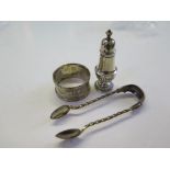 A pair of Victorian silver sugar nips, a napkin ring and a silver pepper