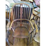 A 19th century ash and elm Windsor armchair, with later splat, on turned legs with crinoline