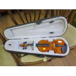 A child's half sized violin, length of back 31cm