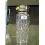 A silver plated cocktail shaker with plated mounts, as found