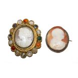 A cameo of a lady's head and shoulders in Greek style set in a frame with sixteen hard stones, as