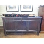 An 18th century oak three panel coffer, with carved frame, 134cm wide 57cm deep 70cm high