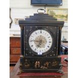 A 19th century continental Chinoiserie bracket clock, with stepped top over a gilt painted enamel