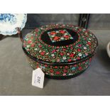 A Huntley & Palmers circular biscuit tin with floral scroll decoration 19cm diameter