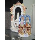 A Victorian Staffordshire figure group of a couple standing over a boat passing through an arch 10cm