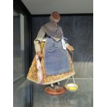 A vintage French Santons d'Art Provence figure with terracotta hand painted face and hands