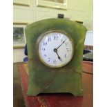 A 1920s Onyx table clock, with enamel dial and single train balance wheel movement, 21cm high