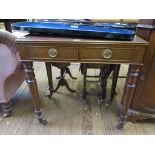 A 19th century mahogany writing desk, the leather inset top over two frieze drawers on turned legs