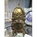 A reproduction brass miniature lantern clock, with jewelled movement, 16cm high