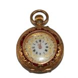 A ladies 18 carat gold fob watch having enamel scene to the back cover and red enamel around the