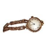 A ladies 9 carat gold wristwatch on 9 carat gold integral bracelet