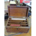 An oak stationery box, rectangular with slightly sloping lid and fitted interior, 25cm wide