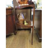 A George III mahogany and boxwood strung corner washstand, on outsplayed legs 64cm wide, 101cm high
