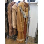 A red fox fur coat by Elliston and Cavell and two other fur coats, a hat and a stole