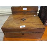 An early 19th century mahogany writing box with ebony inlay 33cm wide, and a carved oak box, in