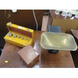 A cased set of brass weights from 1kg to 1g, and a Waylux set of kitchen scales with Imperial