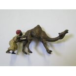 A small cold painted bronze of a camel and young boy, unmarked, 4.5cm high
