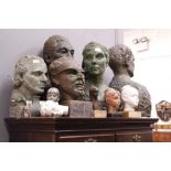 A SMALL COLLECTION OF STUDIO BUSTS of varying styles and sizes, some on wooden plinths, from the
