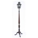 A HEPPLEWHITE STYLE MAHOGANY LAMP of reeded form, topped with a brass lantern, 205cm high
