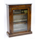 A VICTORIAN WALNUT PIER CABINET with single glazed door and plinth base, 73cm wide x 94cm high