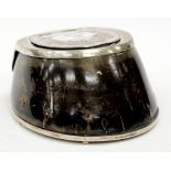 A HORSESHOE INKWELL with white metal mounts and engraved decoration to the top, 12cm across