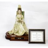 A ROYAL WORCESTER FIGURINE OF QUEEN ANNE, numbered 11/250 with certificate of authenticity, modelled