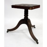 A GEORGE III MAHOGANY TRIPOD TABLE BASE on brass casters, 70cm high