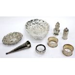 A SELECTION OF SILVER including a butter dish in the form of a shell, two napkin rings, a bonbon