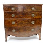 A 19TH CENTURY MAHOGANY BOW FRONTED CHEST OF TWO SHORT AND THREE LONG DRAWERS standing on splaying