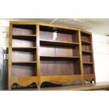 A MAHOGANY OPEN FRONTED BOOKCASE with shaped front, 152.5cm wide x 95cm high
