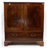 A GEORGE III MAHOGANY LINEN PRESS, the twin doors enclosing slides within over one long drawer and