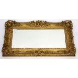 A GILT GESSO RECTANGULAR FRAMED WALL MIRROR, 73cm x 37cm