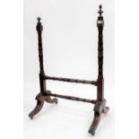 A REGENCY MAHOGANY CHEVAL MIRROR FRAME on turned supports, acanthus leaf carvings and brass casters,