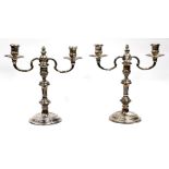 A PAIR OF SILVER TWO BRANCH CANDELABRA with knopped stem, dated 1961, 27cm high